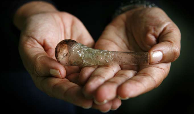 hand holding crystal meth pipe